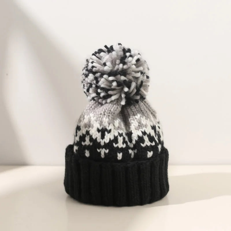 Isolinda | Women's Snowflake Pattern Pom Beanie - Image 1